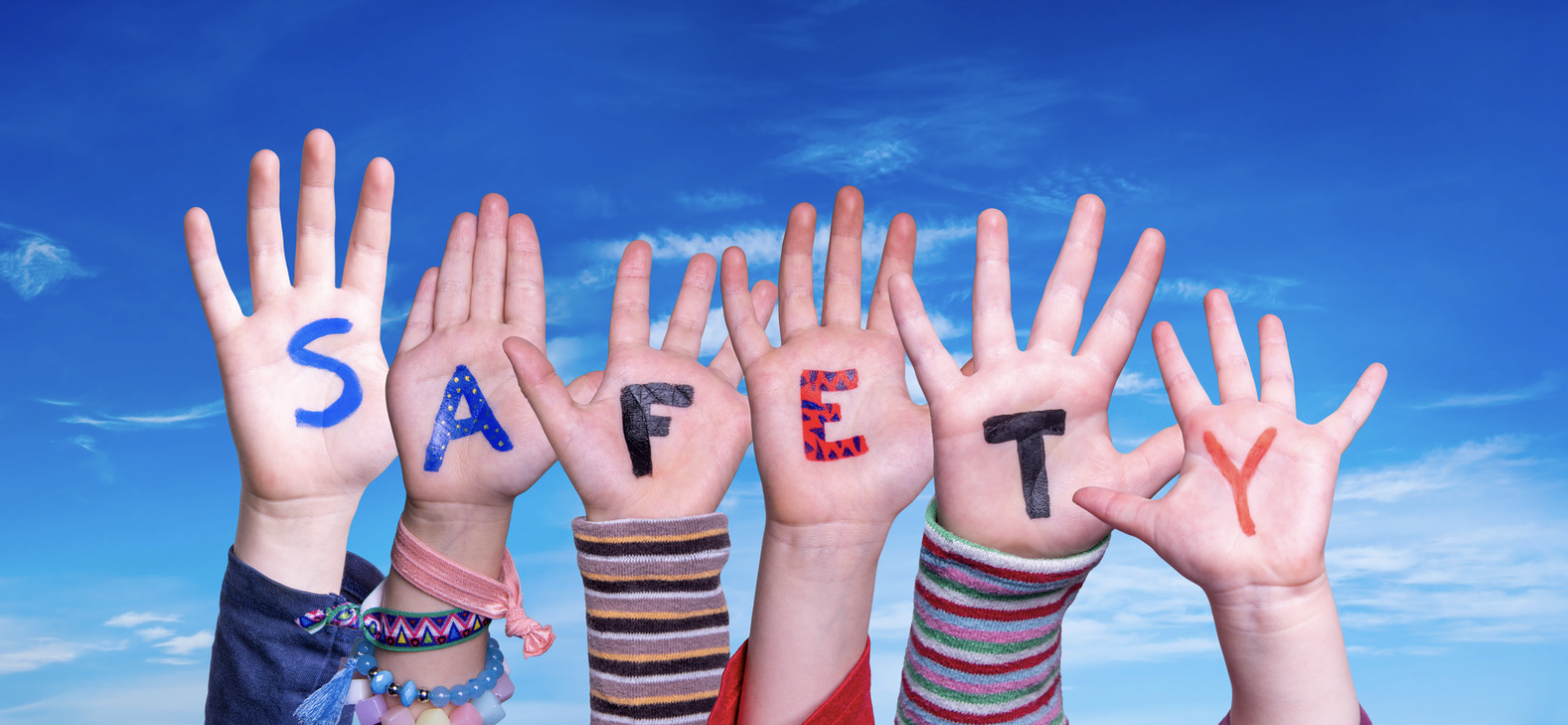 Safety written on children's hands